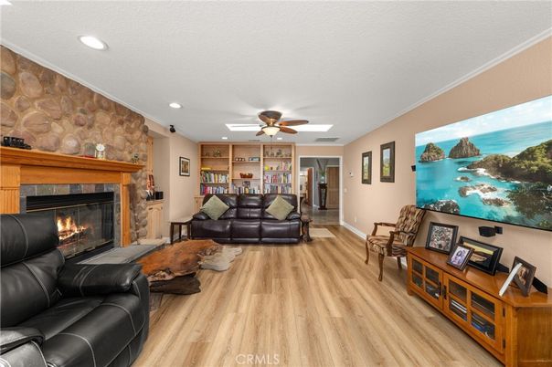Fireplace, Interior, Living room, Recessed Lighting, Stone Walls, Wood Texture Flooring