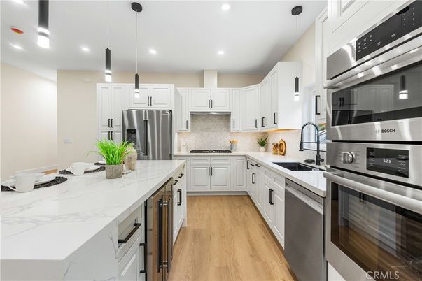 Interior, Kitchen, Pendant Lights, Recessed Lighting, Stainless Steel Appliances, Wood Texture Flooring