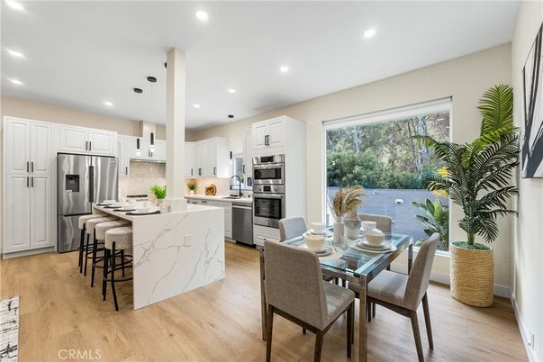 Dining room, Interior, Kitchen, Pendant Lights, Recessed Lighting, Stainless Steel Appliances, Wood Texture Flooring