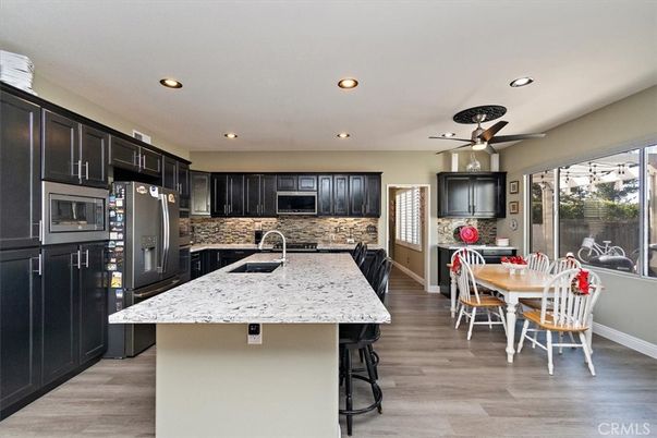 Dining room, Interior, Kitchen, Recessed Lighting, Stainless Steel Appliances, Wood Texture Flooring