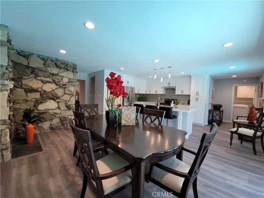Dining room, Interior, Kitchen, Pendant Lights, Recessed Lighting, Stainless Steel Appliances, Stone Walls, Wood Texture Flooring