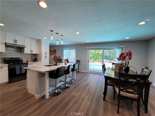 Dining room, Interior, Kitchen, Pendant Lights, Recessed Lighting, Stainless Steel Appliances, Wood Texture Flooring