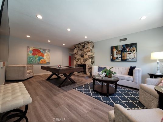 Billiard Table, Fireplace, Game Room, Interior, Living room, Recessed Lighting, Stone Walls, Wood Texture Flooring