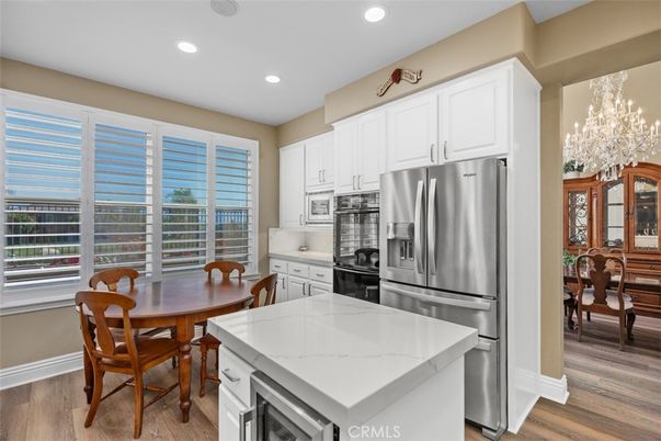 Chandelier, Dining room, Interior, Kitchen, Recessed Lighting, Stainless Steel Appliances, Wood Texture Flooring