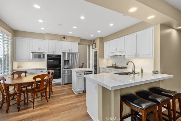 Dining room, Interior, Kitchen, Recessed Lighting, Stainless Steel Appliances, Wood Texture Flooring