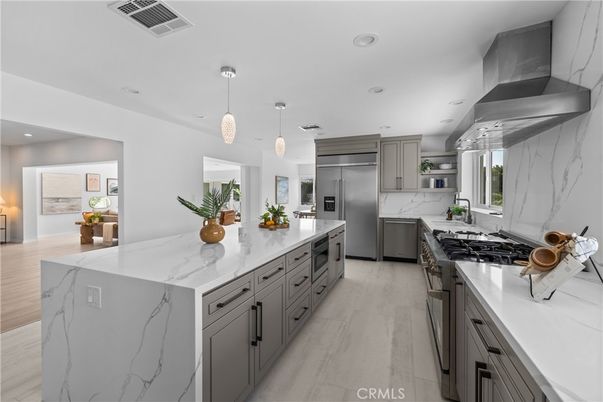 Interior, Kitchen, Marble Walls, Pendant Lights, Recessed Lighting, Stainless Steel Appliances, Wood Texture Flooring