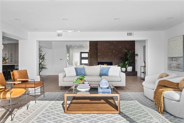 Fireplace, Interior, Living room, Recessed Lighting, Stone Walls, Wood Texture Flooring