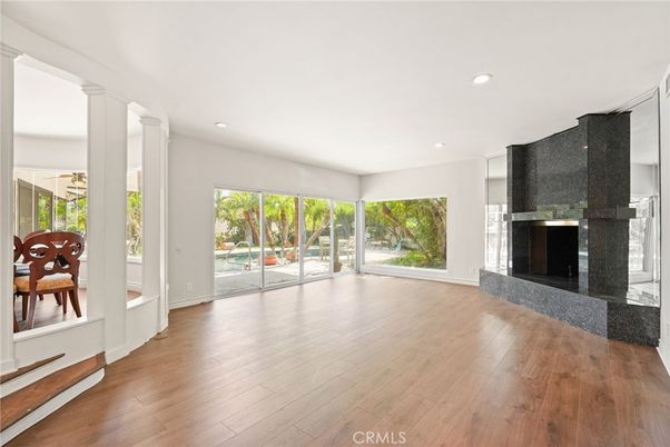 Dining room, Empty room, Fireplace, Interior, Recessed Lighting, Wood Texture Flooring