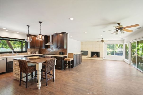 Fireplace, Interior, Kitchen, Pendant Lights, Recessed Lighting, Stainless Steel Appliances, Wood Texture Flooring