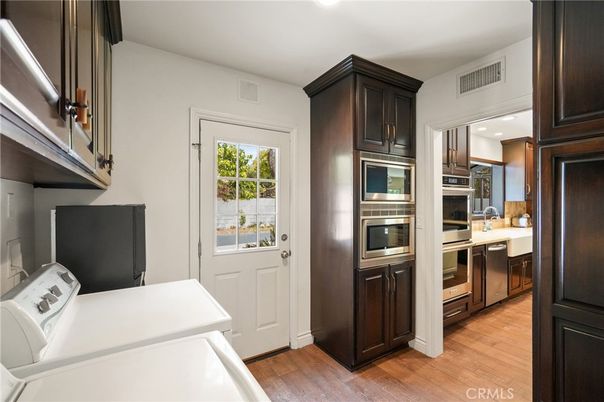 Interior, Kitchen, Recessed Lighting, Stainless Steel Appliances, Washer, Wood Texture Flooring