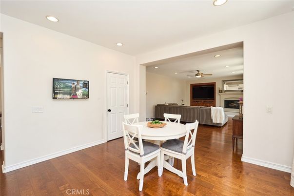 Dining room, Fireplace, Interior, Living room, Recessed Lighting, Wood Texture Flooring