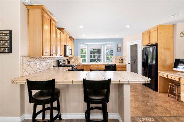 Interior, Kitchen, Recessed Lighting, Tile Countertops, Wood Texture Flooring