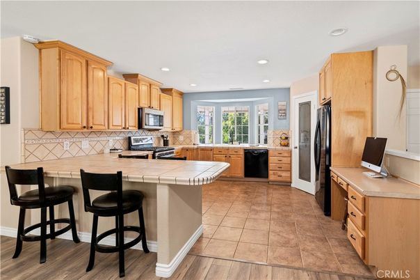 Interior, Kitchen, Recessed Lighting, Tile Countertops, Wood Texture Flooring