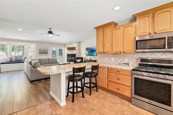Fireplace, Interior, Kitchen, Living room, Recessed Lighting, Tile Countertops, Wood Texture Flooring