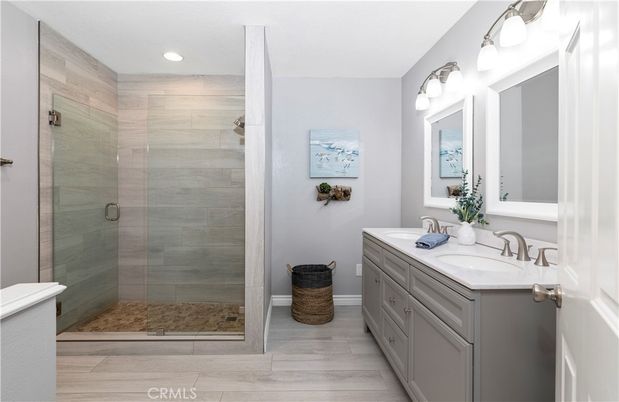 Bathroom, Dual Sink Vanities, Glass Shower, Interior, Recessed Lighting, Wood Texture Flooring