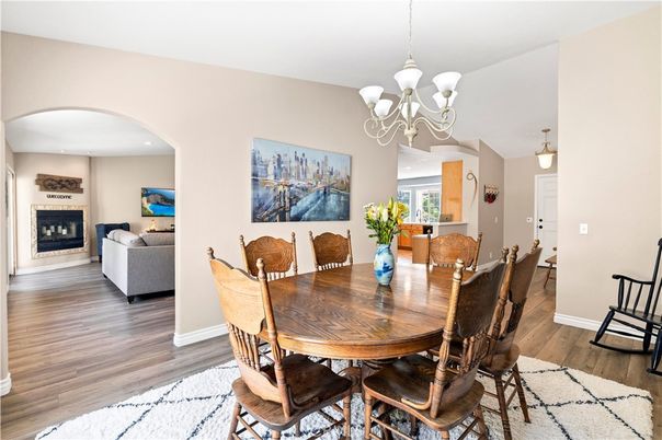 Chandelier, Dining room, Fireplace, Interior, Living room, Pendant Lights, Recessed Lighting, Wood Texture Flooring