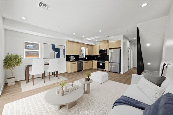 Dining room, Interior, Kitchen, Living room, Recessed Lighting, Stainless Steel Appliances, Wood Texture Flooring