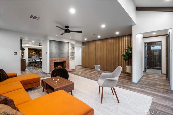 Dining room, Fireplace, Interior, Living room, Recessed Lighting, Wood Texture Flooring