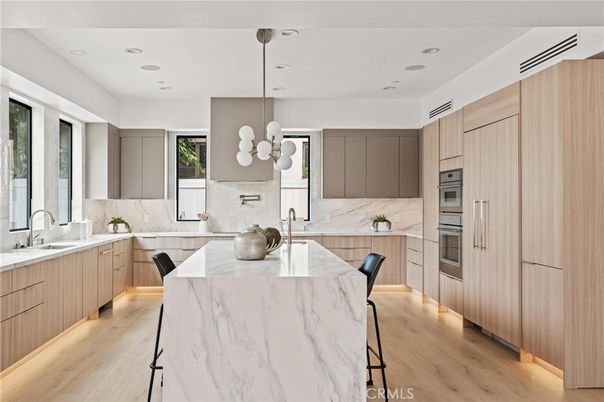 Interior, Kitchen, Marble Walls, Pendant Lights, Recessed Lighting, Stainless Steel Appliances, Wood Texture Flooring
