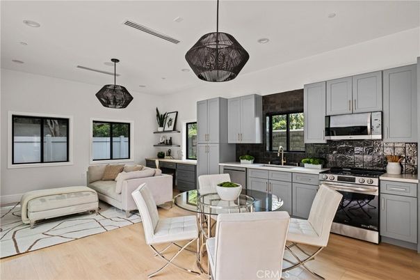 Dining room, Interior, Kitchen, Living room, Pendant Lights, Recessed Lighting, Stainless Steel Appliances, Wood Texture Flooring
