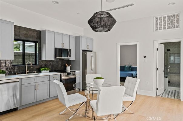 Dining room, Interior, Kitchen, Pendant Lights, Recessed Lighting, Stainless Steel Appliances, Wood Texture Flooring
