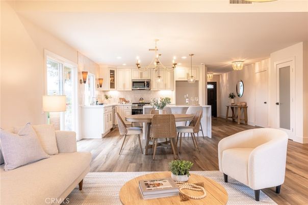 Chandelier, Dining room, Interior, Kitchen, Living room, Pendant Lights, Stainless Steel Appliances, Wood Texture Flooring