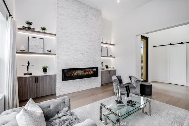 Fireplace, Interior, Living room, Recessed Lighting, Stone Walls, Wood Texture Flooring