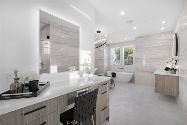 Bathroom, Dual Sink Vanities, Free Standing Baths, Glass Shower, Interior, Marble Walls, Pendant Lights, Recessed Lighting