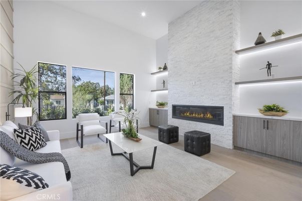 Fireplace, Interior, Living room, Recessed Lighting, Stone Walls, Wood Texture Flooring