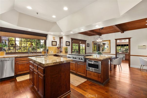 Chandelier, Dining room, Interior, Kitchen, Pendant Lights, Recessed Lighting, Stainless Steel Appliances, Wooden Beams, Wooden Ceilings, Wood Texture Flooring