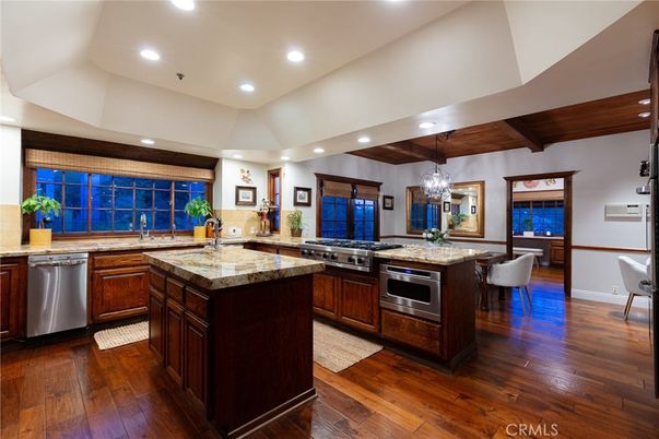 Chandelier, Dining room, Interior, Kitchen, Recessed Lighting, Stainless Steel Appliances, Wooden Beams, Wooden Ceilings, Wood Texture Flooring
