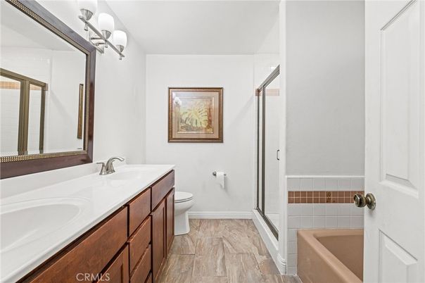 Bathroom, Dual Sink Vanities, Glass Shower, Interior, Wood Texture Flooring