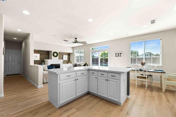Dining room, Fireplace, Interior, Kitchen, Recessed Lighting, Wood Texture Flooring