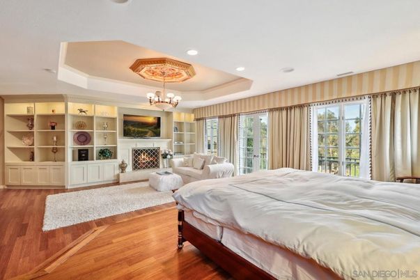 Bedroom, Chandelier, Fireplace, Interior, Recessed Lighting, Wood Texture Flooring