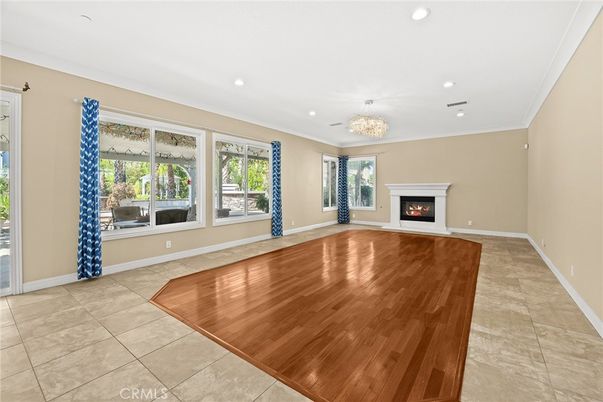 Chandelier, Empty room, Fireplace, Interior, Recessed Lighting, Wood Texture Flooring
