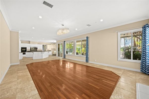 Chandelier, Empty room, Interior, Kitchen, Recessed Lighting, Stainless Steel Appliances, Wood Texture Flooring