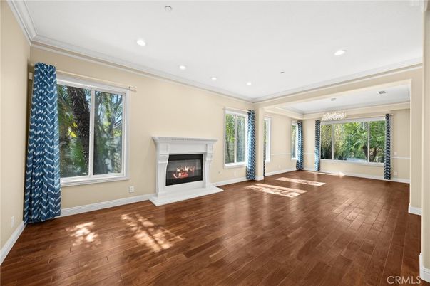 Chandelier, Empty room, Fireplace, Interior, Recessed Lighting, Wood Texture Flooring