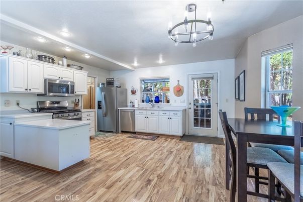 Dining room, Interior, Kitchen, Recessed Lighting, Stainless Steel Appliances, Wood Texture Flooring