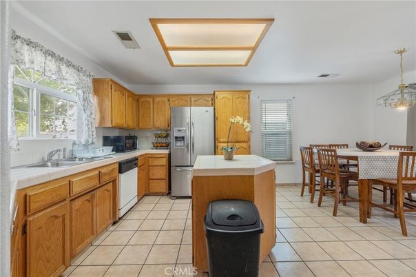 Dining room, Interior, Kitchen, Pendant Lights, Stainless Steel Appliances, Tile Countertops
