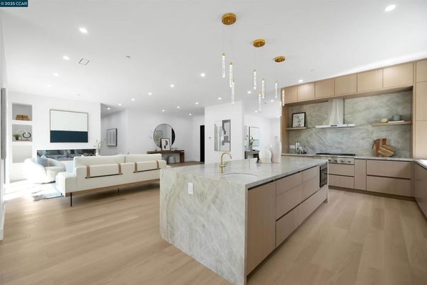 Interior, Kitchen, Living room, Marble Walls, Pendant Lights, Recessed Lighting, Stainless Steel Appliances, Wood Texture Flooring