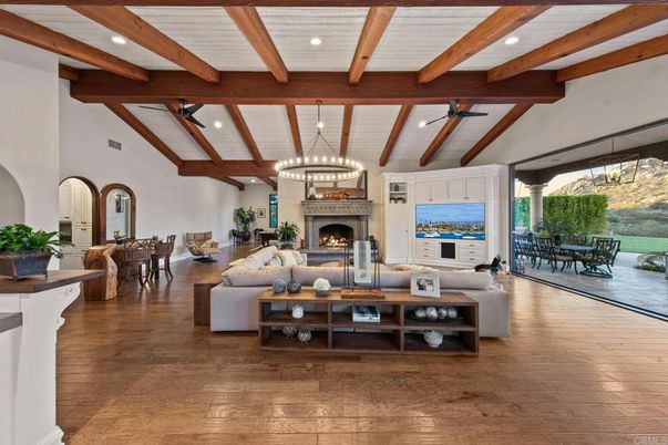 Chandelier, Dining room, Fireplace, Interior, Living room, Pendant Lights, Recessed Lighting, Wooden Beams, Wood Texture Flooring