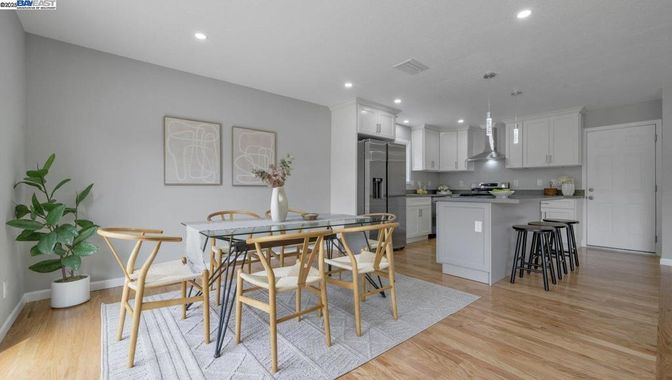 Dining room, Interior, Kitchen, Recessed Lighting, Stainless Steel Appliances, Wood Texture Flooring