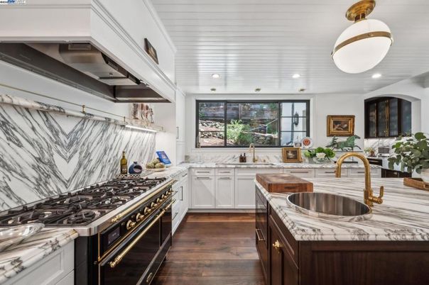 Interior, Kitchen, Marble Walls, Recessed Lighting, Stainless Steel Appliances, Wood Texture Flooring