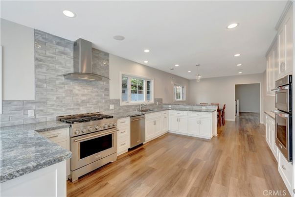 Interior, Kitchen, Pendant Lights, Recessed Lighting, Stainless Steel Appliances, Stone Walls, Wood Texture Flooring