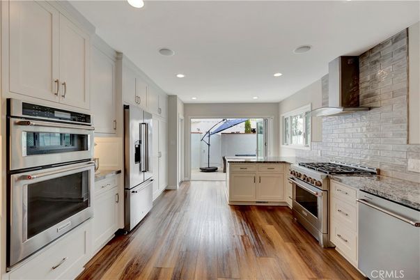 Interior, Kitchen, Recessed Lighting, Stainless Steel Appliances, Stone Walls, Wood Texture Flooring
