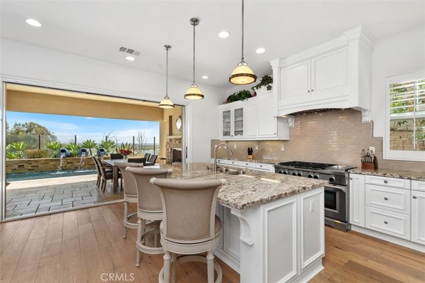 Dining room, Fireplace, Interior, Kitchen, Pendant Lights, Recessed Lighting, Stainless Steel Appliances, Wood Texture Flooring