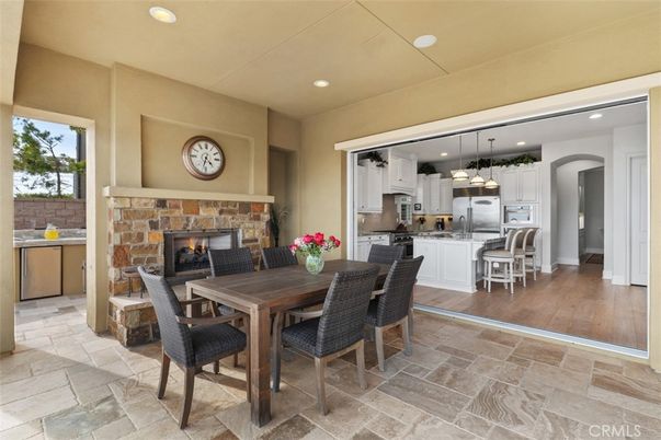 Dining room, Fireplace, Interior, Kitchen, Pendant Lights, Recessed Lighting, Stainless Steel Appliances, Wood Texture Flooring