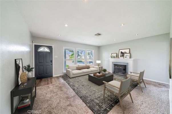 Dining room, Fireplace, Interior, Living room, Recessed Lighting, Wood Texture Flooring