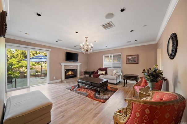 Chandelier, Fireplace, Interior, Living room, Piano, Recessed Lighting, Wood Texture Flooring
