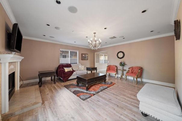 Chandelier, Fireplace, Interior, Living room, Piano, Recessed Lighting, Wood Texture Flooring